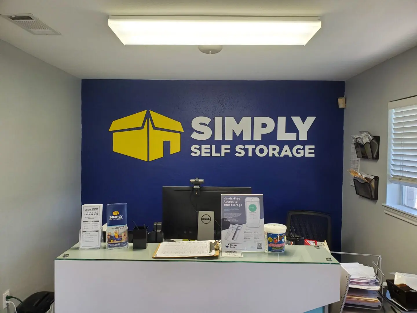 Simply self storage logo on blue color wall
